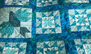Jayne Lacey, Devon UK. 'Surprise Lockdown Bird quilt' made for my daughter and son-in-law in colours to match her bedroom 